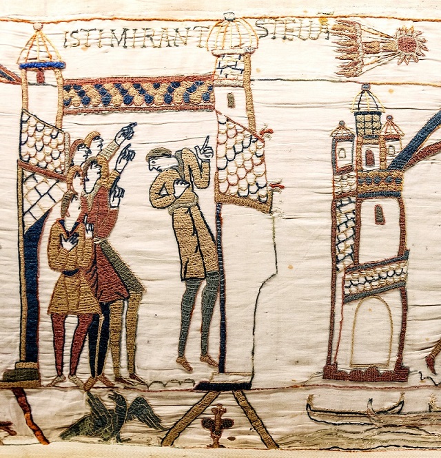 A section of the Bayeux Tapestry, showing some people pointing at a celestial object